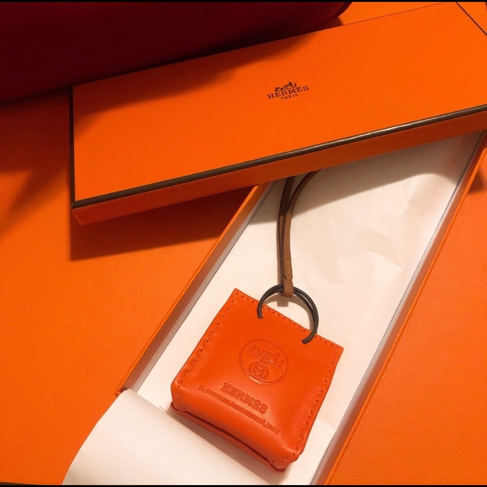 Hermès orange logo bag charm limited